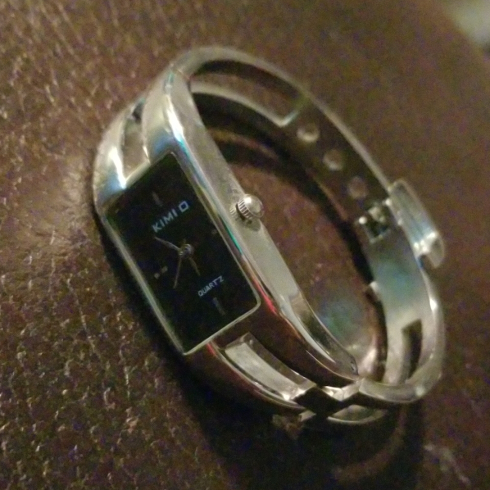 Ladies silver black faced watch